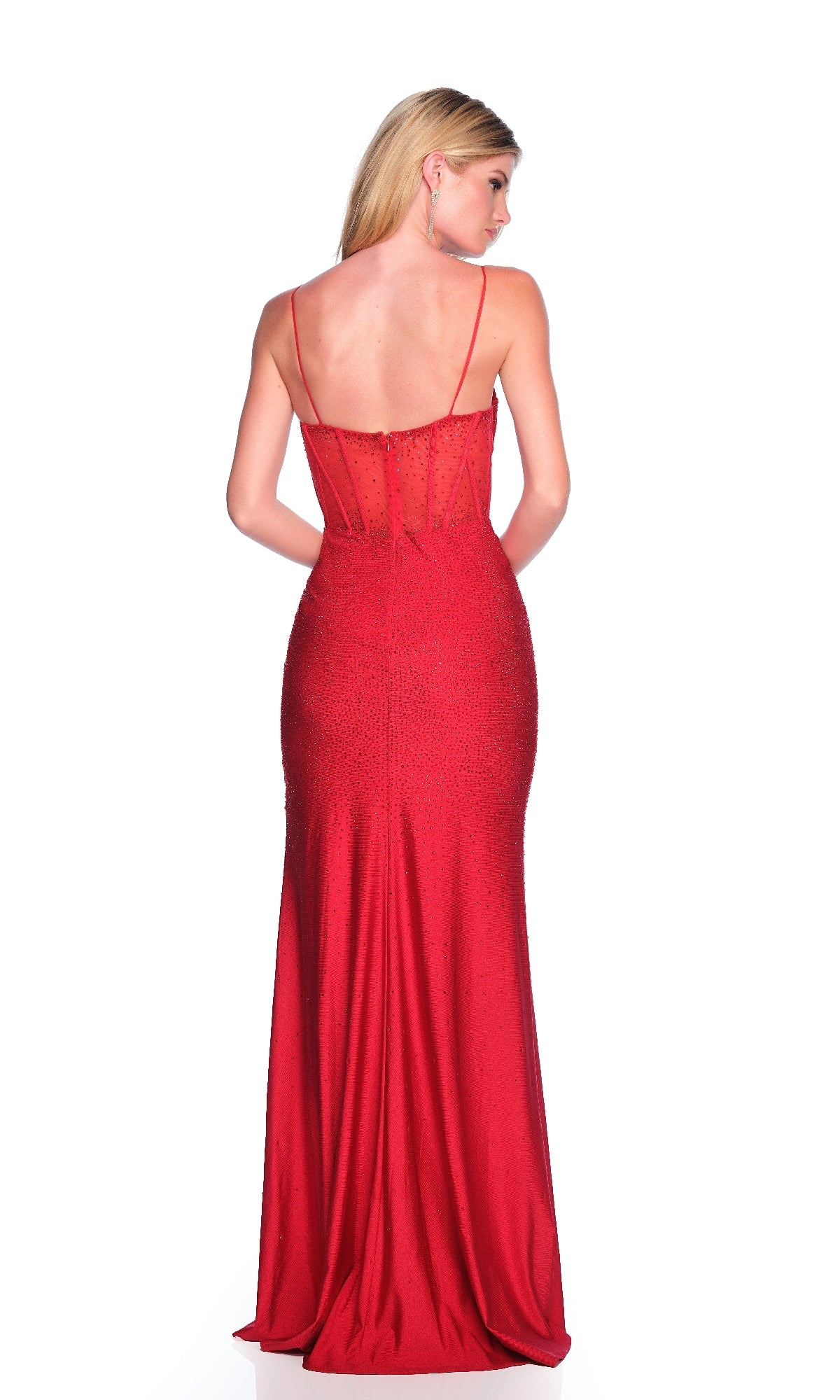 A woman faces away in the Dave & Johnny 11919 long red prom dress, featuring thin straps, a sheer corset bodice, high-leg side slit, and slightly flared floor-length hem against a white background.